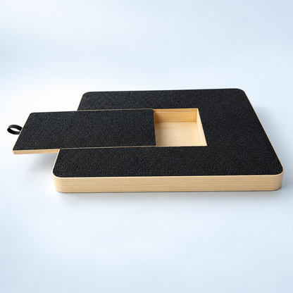PawFile black rectangular wooden dog nail scratch board with the sliding lid open to reveal the treat compartment